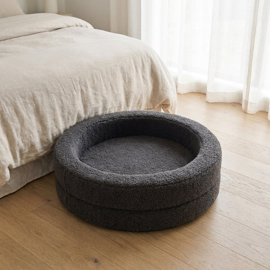 The Calming Nest charcoal plush nest dog bed in a bedroom corner | PawHaus Co |c:Charcoal