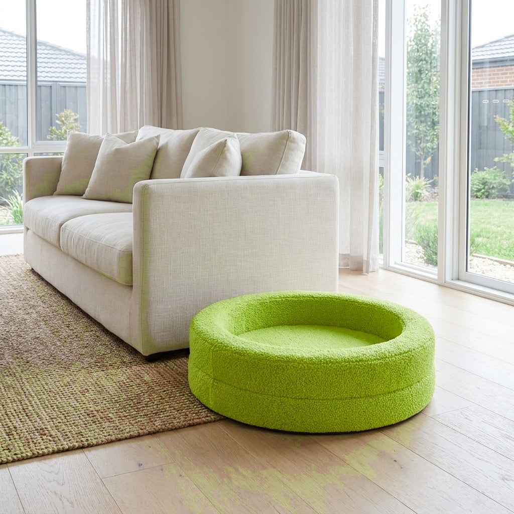 The Calming Nest lime green plush nest dog bed beside a linen sofa | PawHaus Co |c:Lime Green