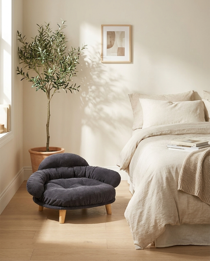 The Cocoon Lounge charcoal corduroy dog sofa in a bedroom corner | PawHaus Co |c:Charcoal