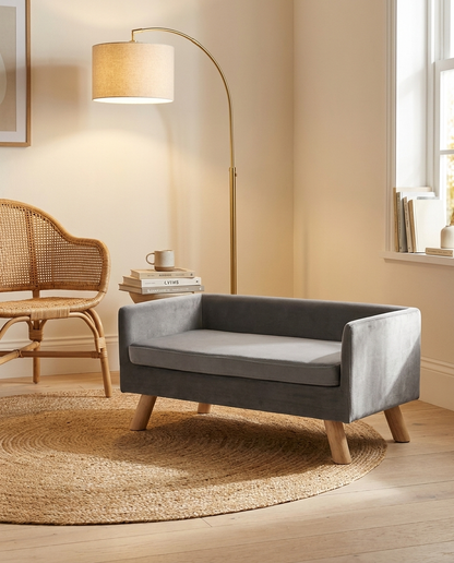 The Lounge grey velvet dog sofa in a cosy reading corner | PawHaus Co