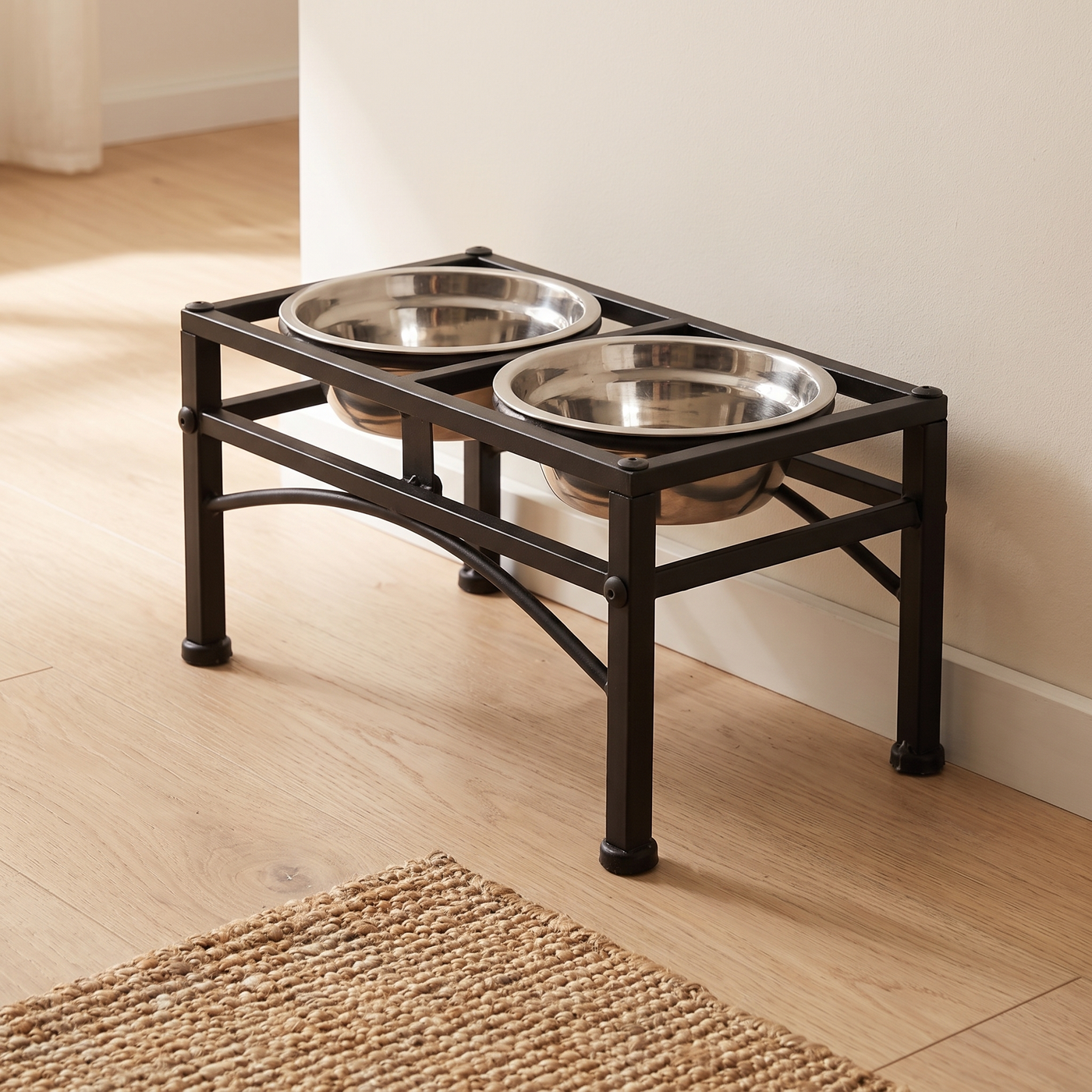The Frame raised twin bowl stand in black iron with two stainless steel bowls